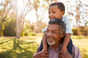 Grandfather outside with grandson